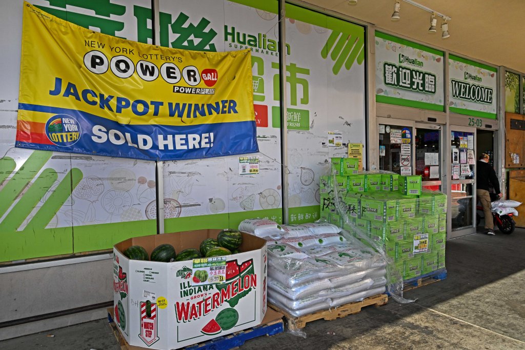 A sign outside of Hua Lin Supermarket in Flushing advertising a previous winning Powerball ticket sold at the store in Decemeber.