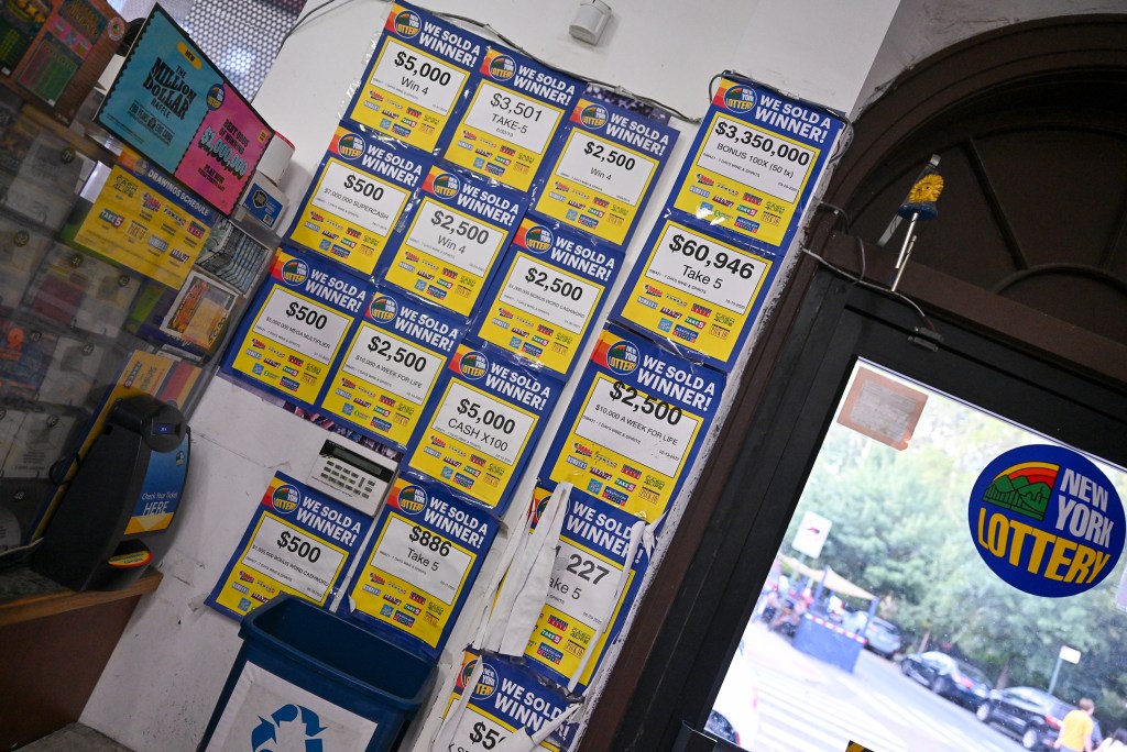 New York Lottery tickets sold at a store showing multiple winning tickets.