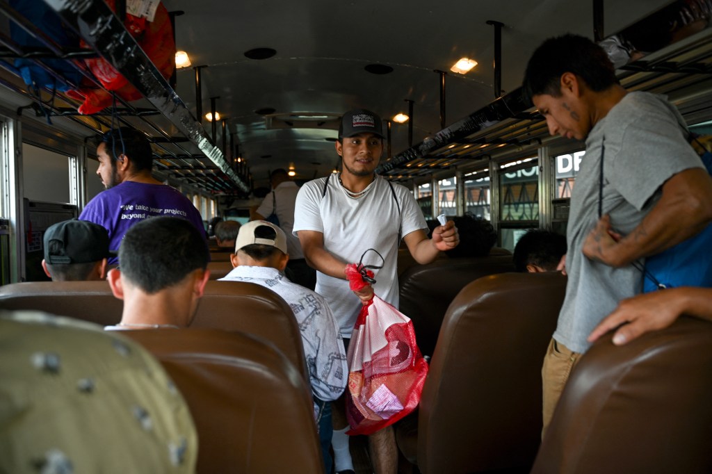 Deported Guatemalan migrants on a bus.