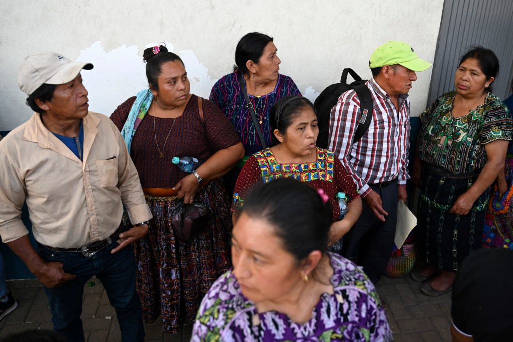 Relatives awaiting the arrival of deported minors at a Guatemalan air force base.