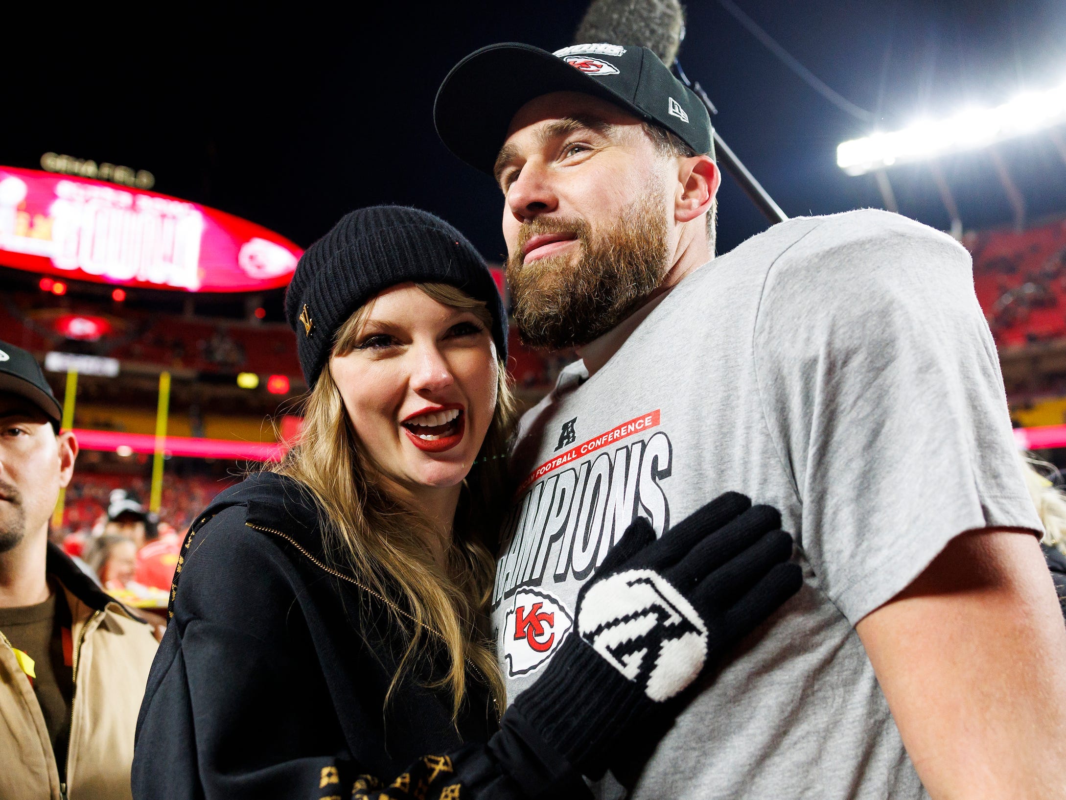 Taylor Swift and Travis Kelce embrace after the Kansas City Chiefs victory on January 26.