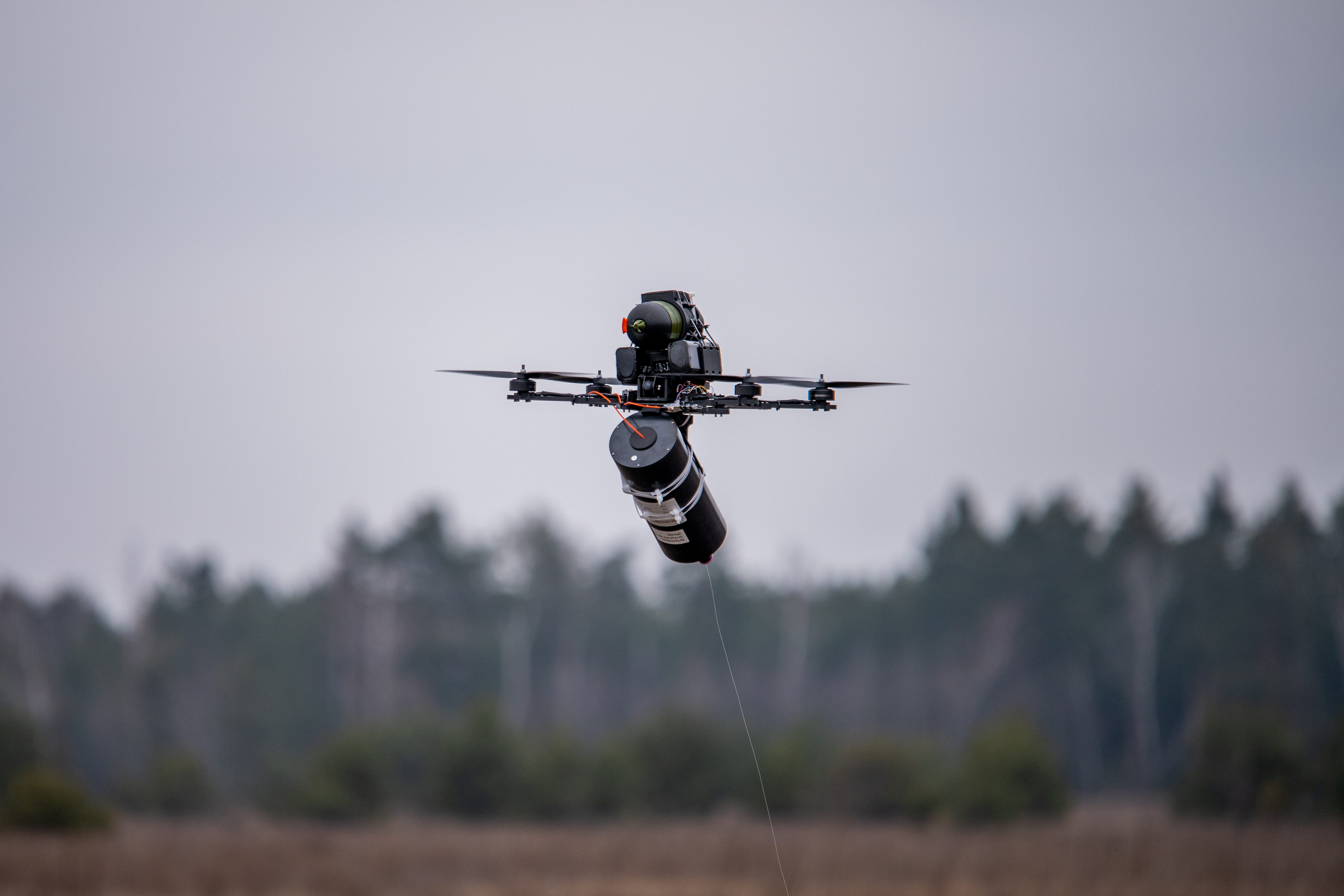 An FPV drone controlled via a fiber-optic cable flies during Ukrainian military training on January 29, 2025, in Kyiv Oblast, Ukraine.