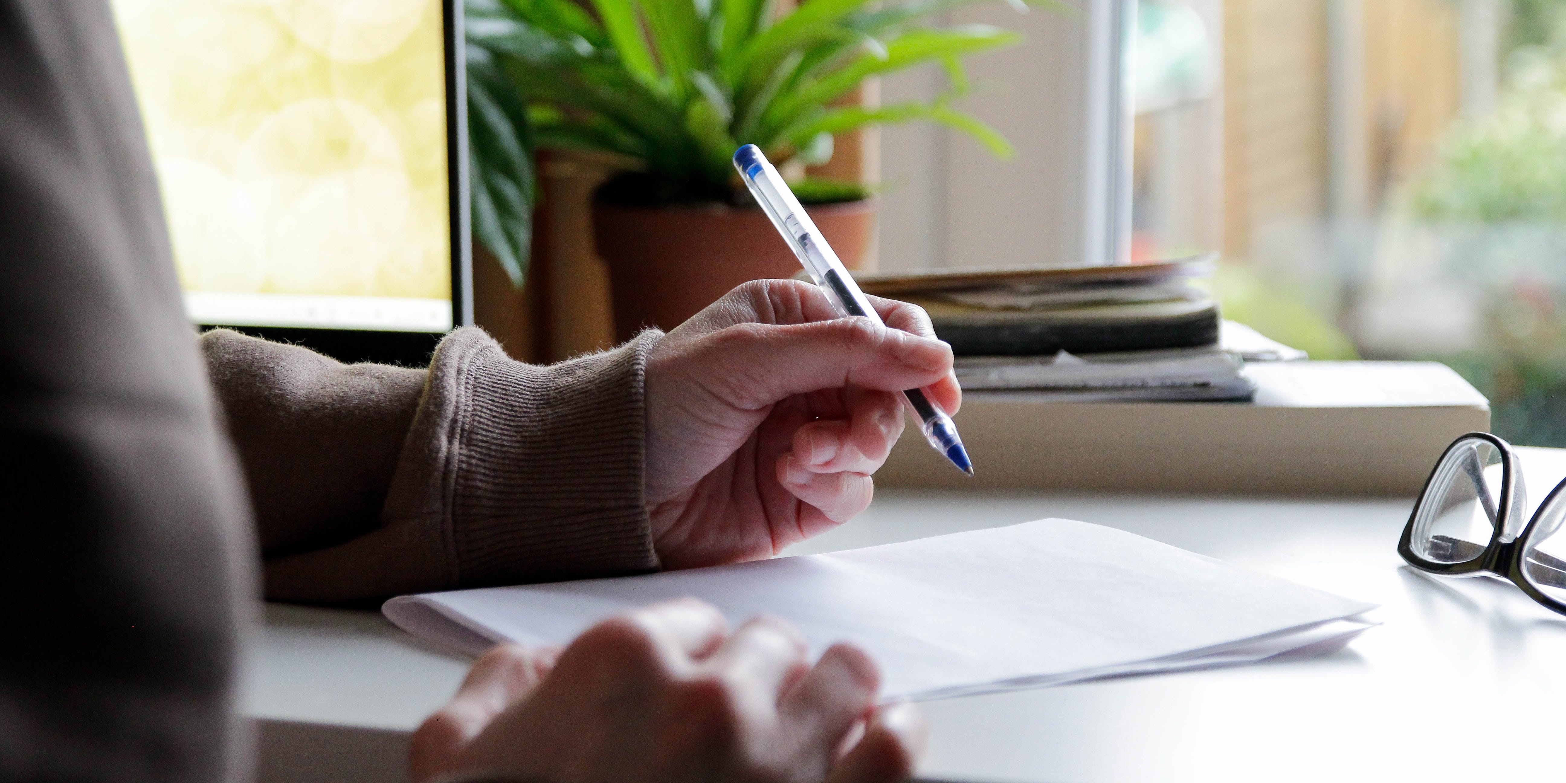 A person holding a pen