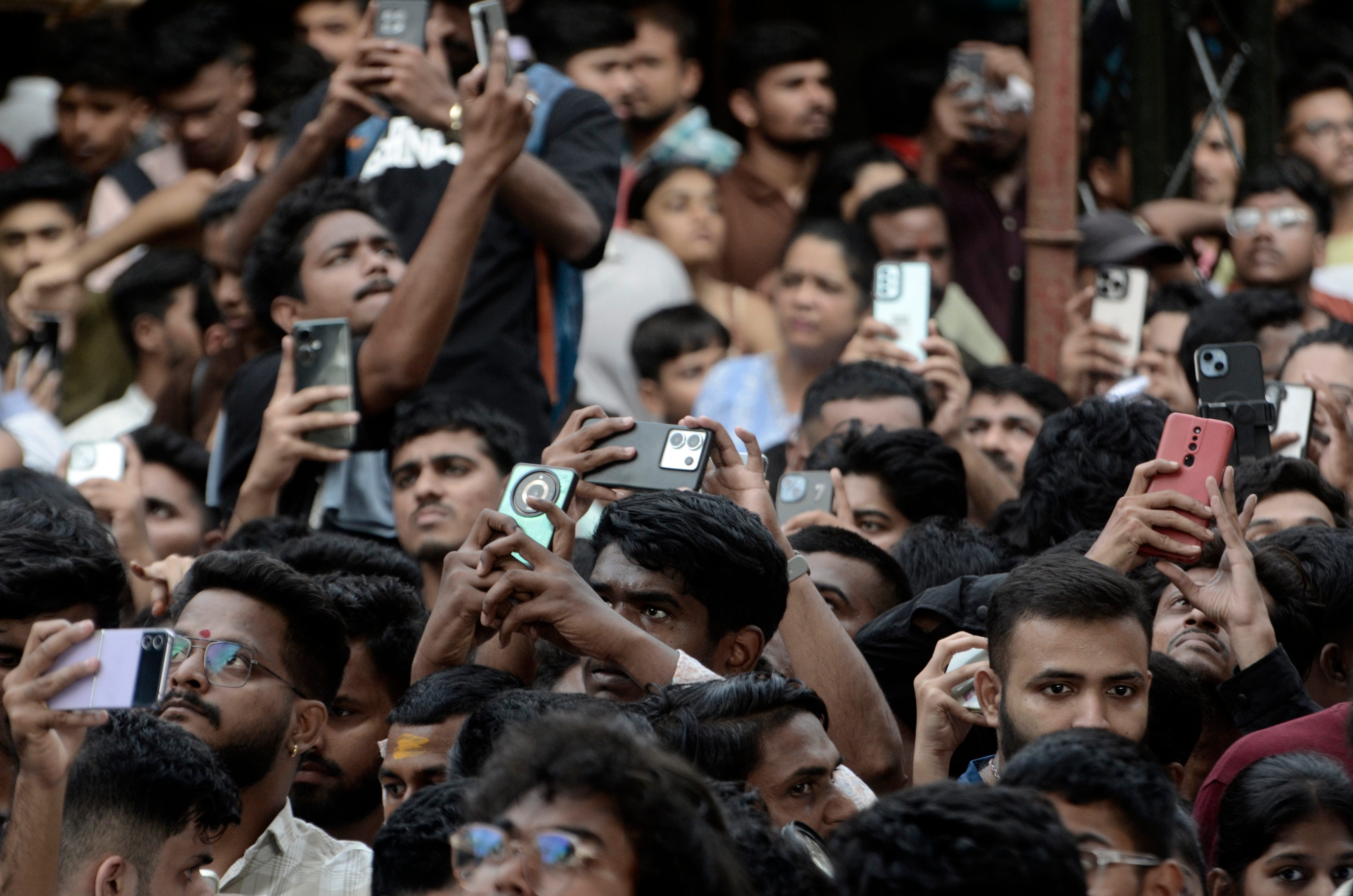 People holding up phones