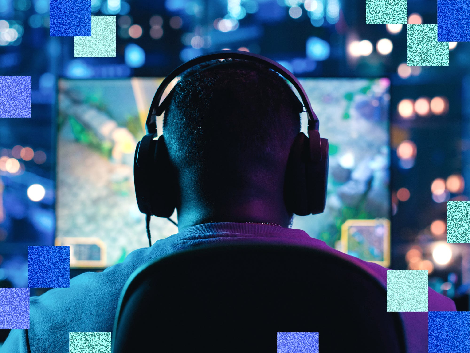 A man sits playing video games in computer