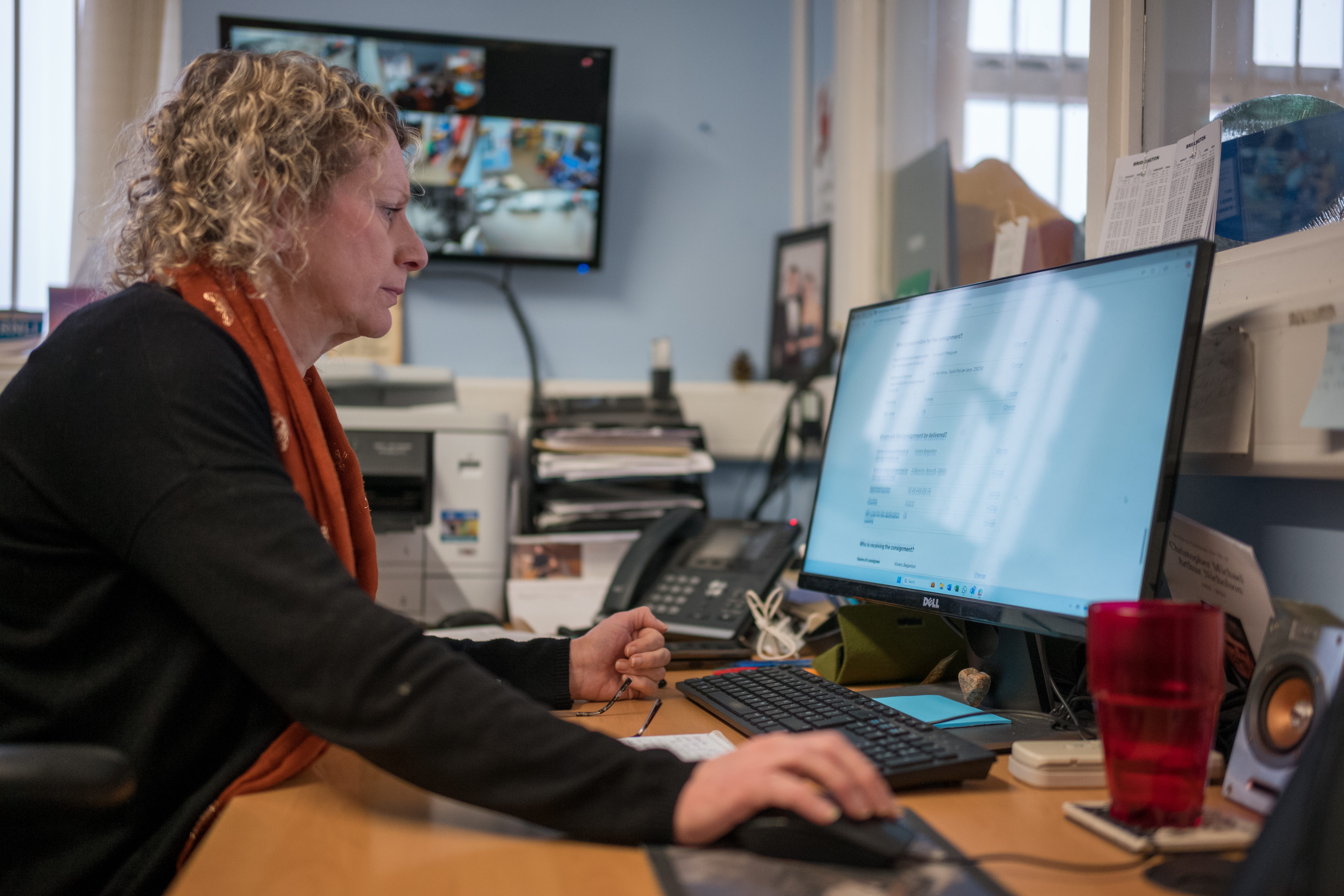 The Independent Shellfishermen's Co-operative (ISC) Company Secretary, Joanne Ackers, completes export paperwork for an order at Bridlington Harbour in Bridlington, England, on January 31, 2025.