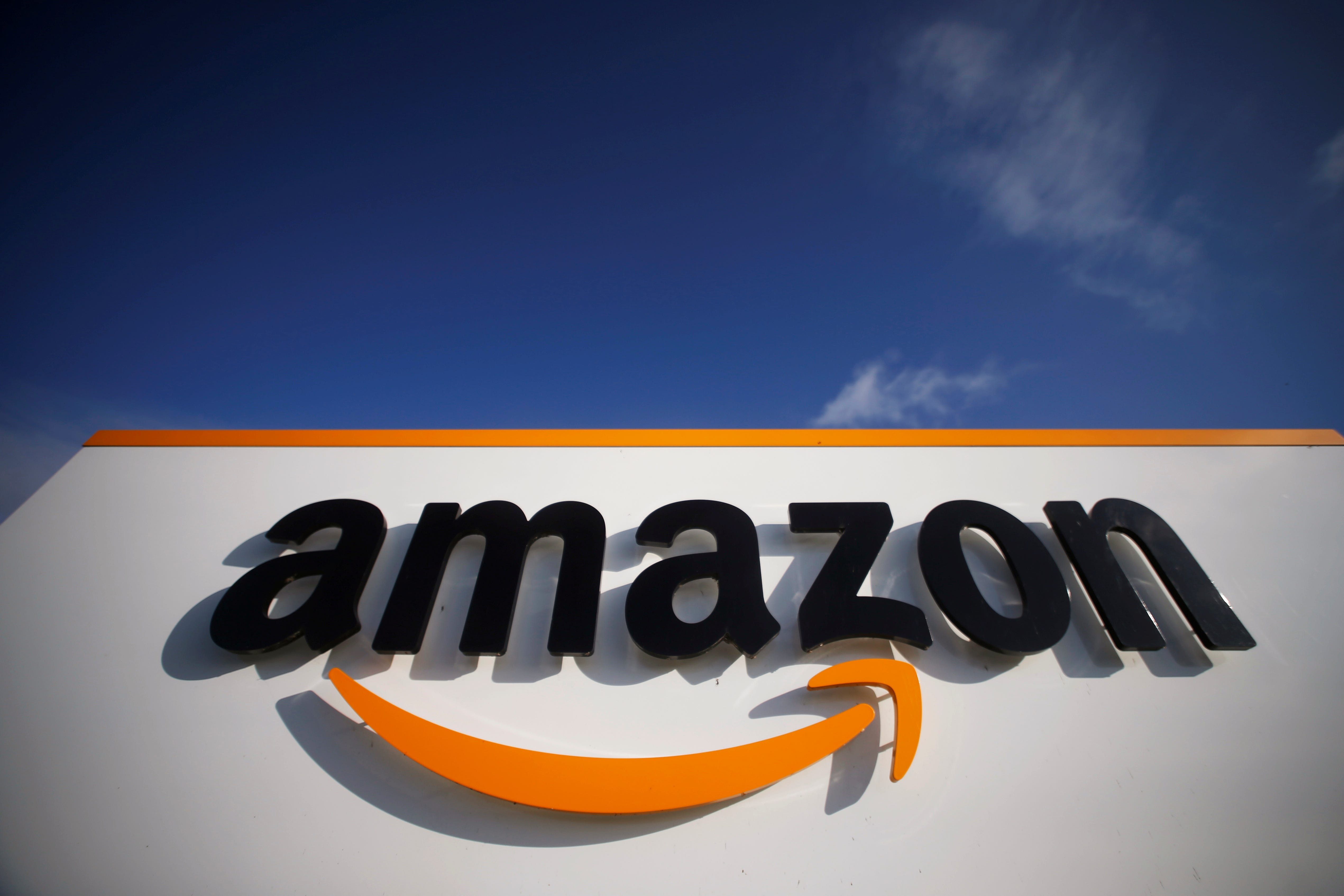 FILE PHOTO: The logo of Amazon is seen at the company logistics centre in Boves, France, November 5, 2019. REUTERS/Pascal Rossignol