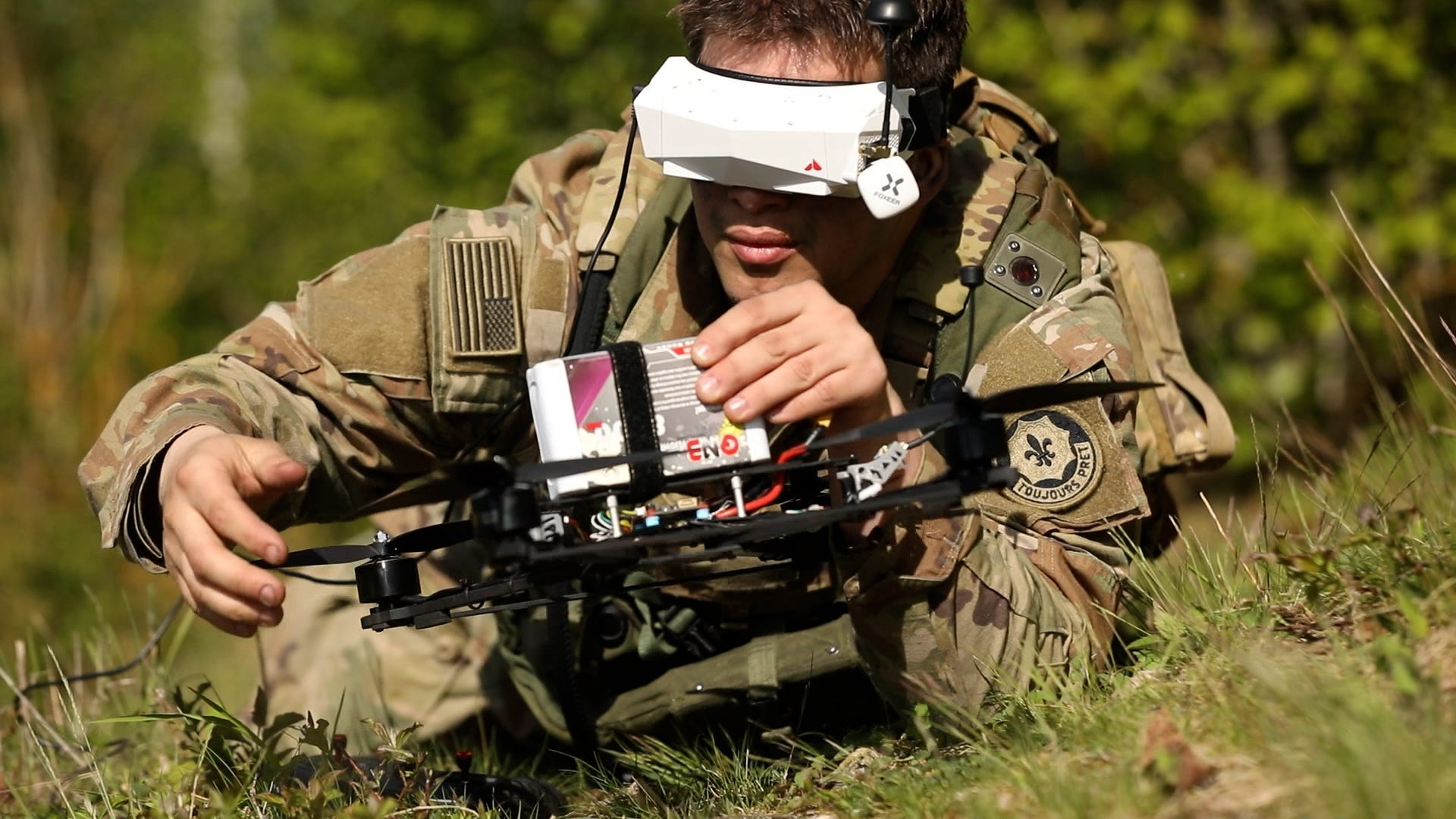 US Army soldier wearing a headset prepares to launch an FPV drone.