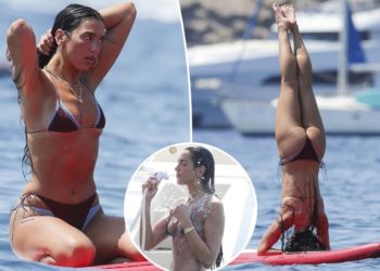Bikini-clad Dua Lipa flaunts shredded abs during paddleboard yoga in Ibiza