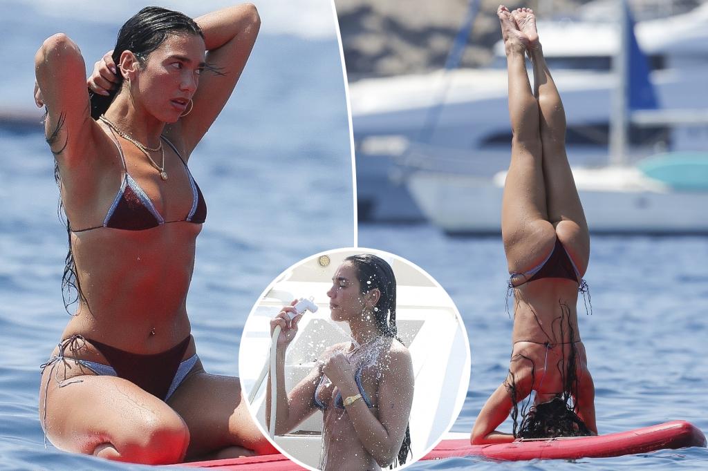 Bikini-clad Dua Lipa flaunts shredded abs during paddleboard yoga in Ibiza