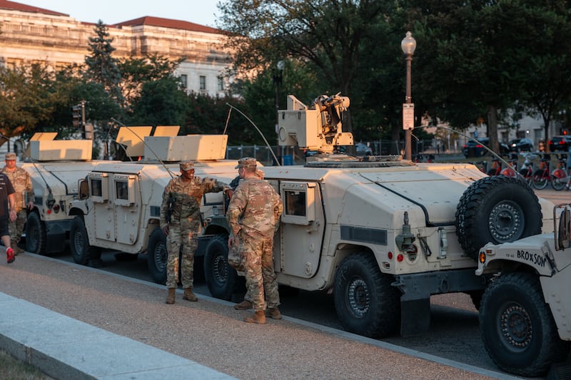 National Guard troops gather near the Washington Monument as part of President Trump's mobilization of law enforcement on August 12, 2025 in Washington, DC. T