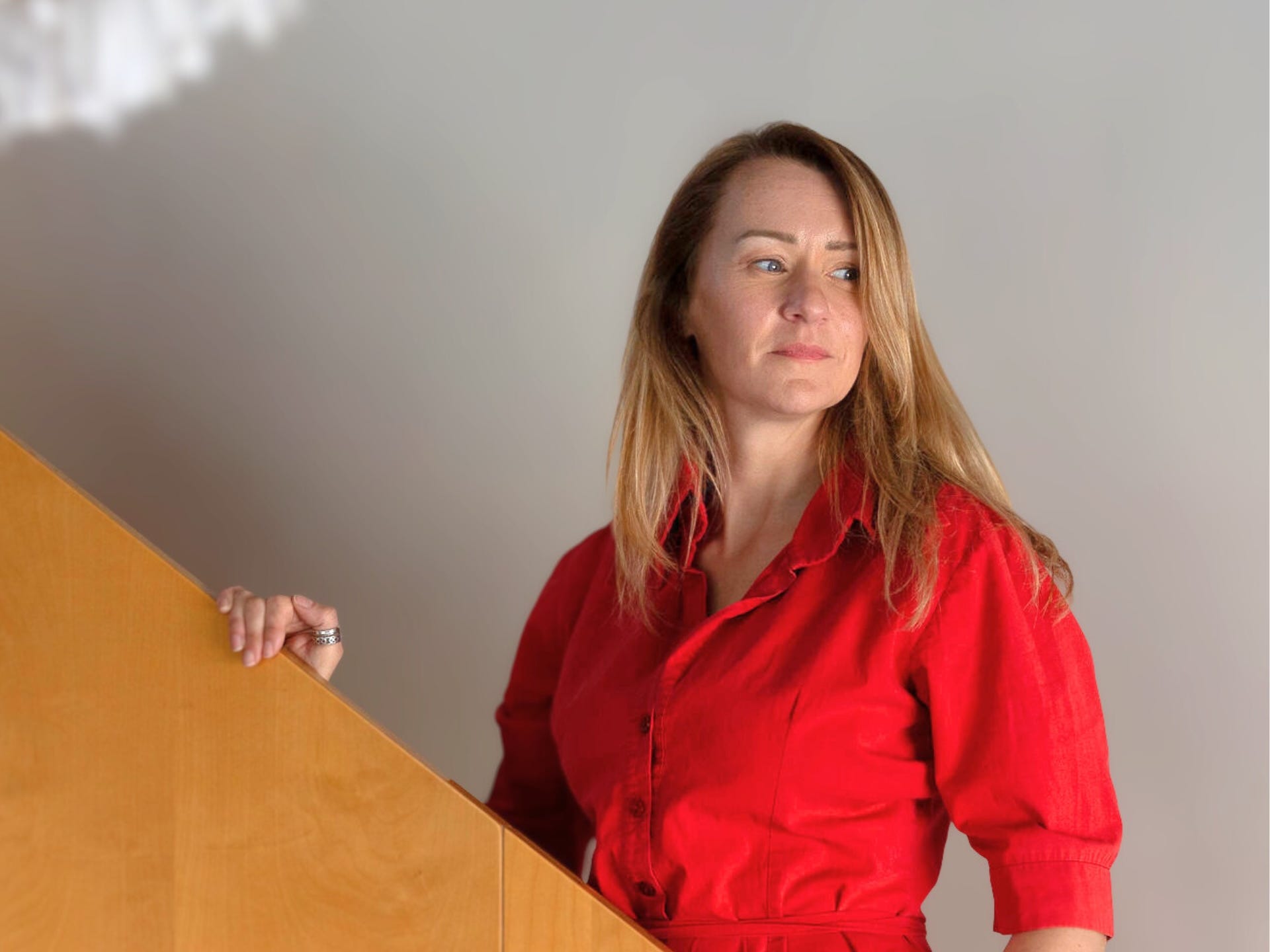 Nicola Prentis wearing a red shirt.