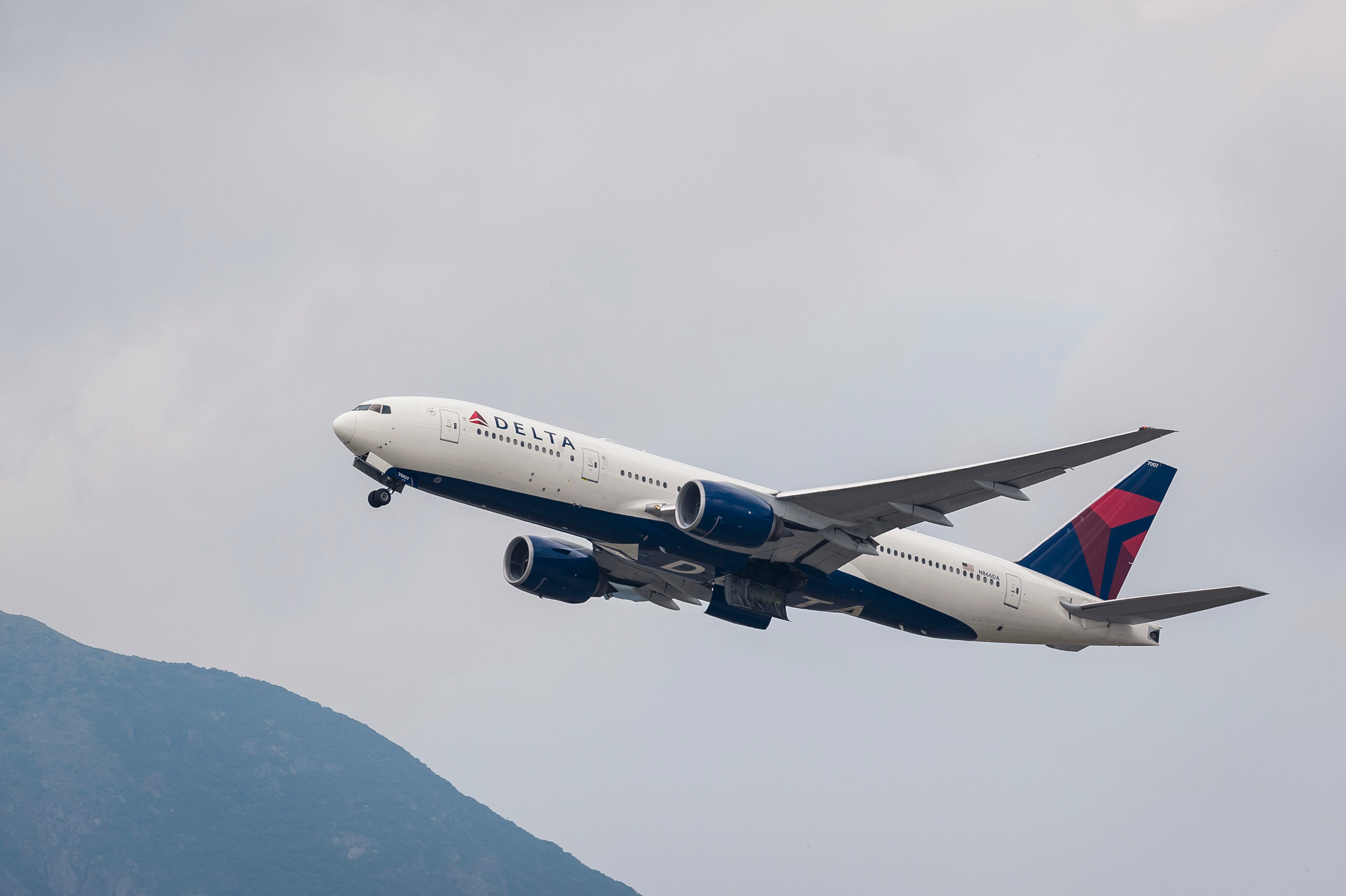 A Boeing 777-232(ER) passenger plane belonging to the Delta Air Lines taking off at Hong Kong International Airport on August 08 2018 i