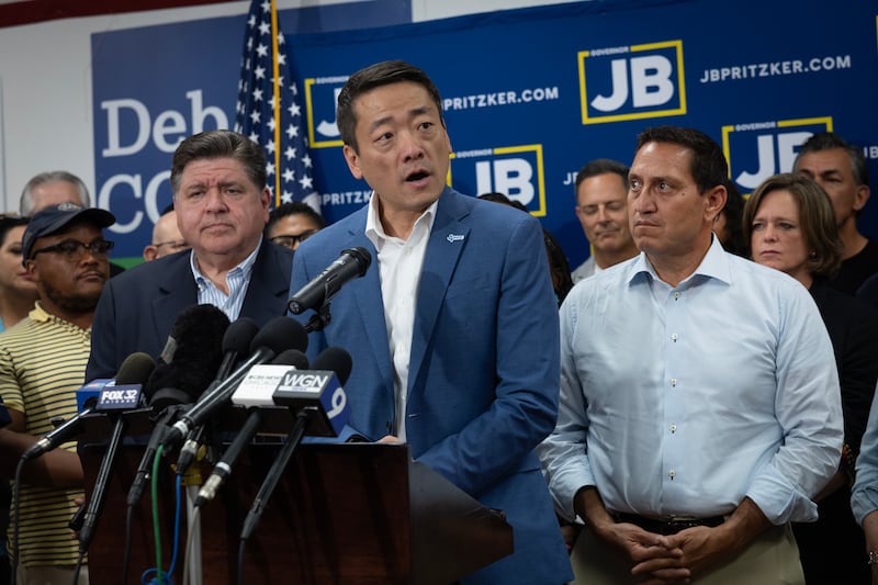 Texas House Democratic Caucus Chair Gene Wu speaks alongside Illinois Governor JB Pritzker after state lawmakers fled Texas so a quorum could not be reached during a special session called to redistrict the state.