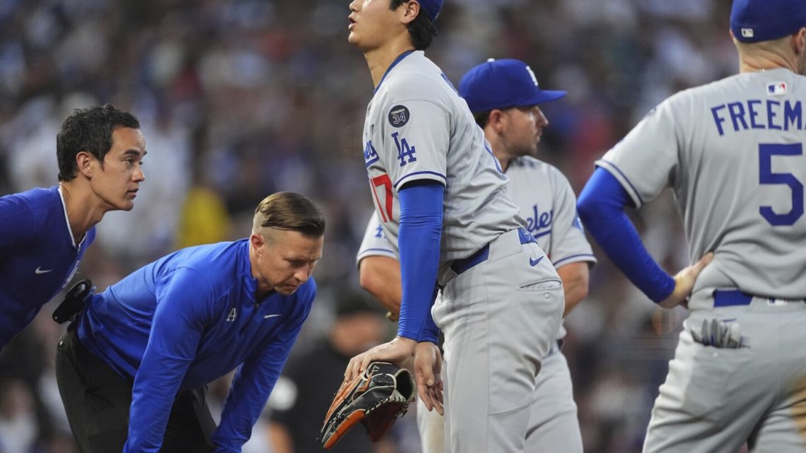 Dodgers’ Ohtani roughed up by Rockies and leaves game after getting hit on knee by line drive