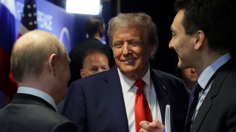 U.S. President Donald Trump talks to Russian President Vladimir Putin after a joint news conference following their meeting at Joint Base Elmendorf-Richardson in Anchorage, Alaska, U.S., August 15, 2025. Sputnik/Gavriil Grigorov/Pool via REUTERS ATTENTION EDITORS - THIS IMAGE WAS PROVIDED BY A THIRD PARTY.