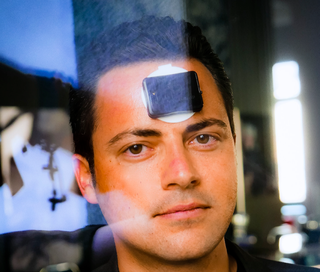 Man with a device on his forehead.