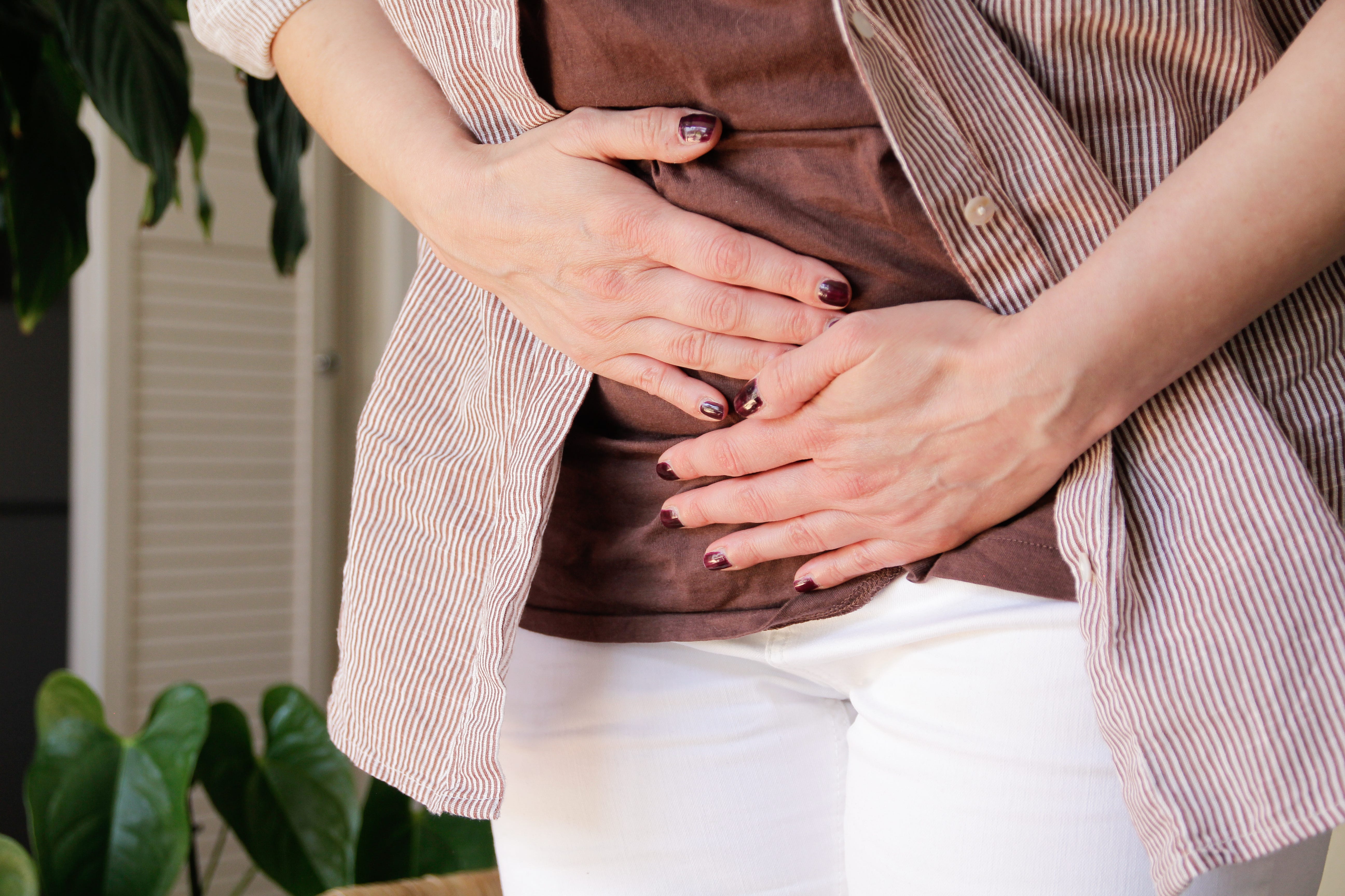 person with stomach cramps