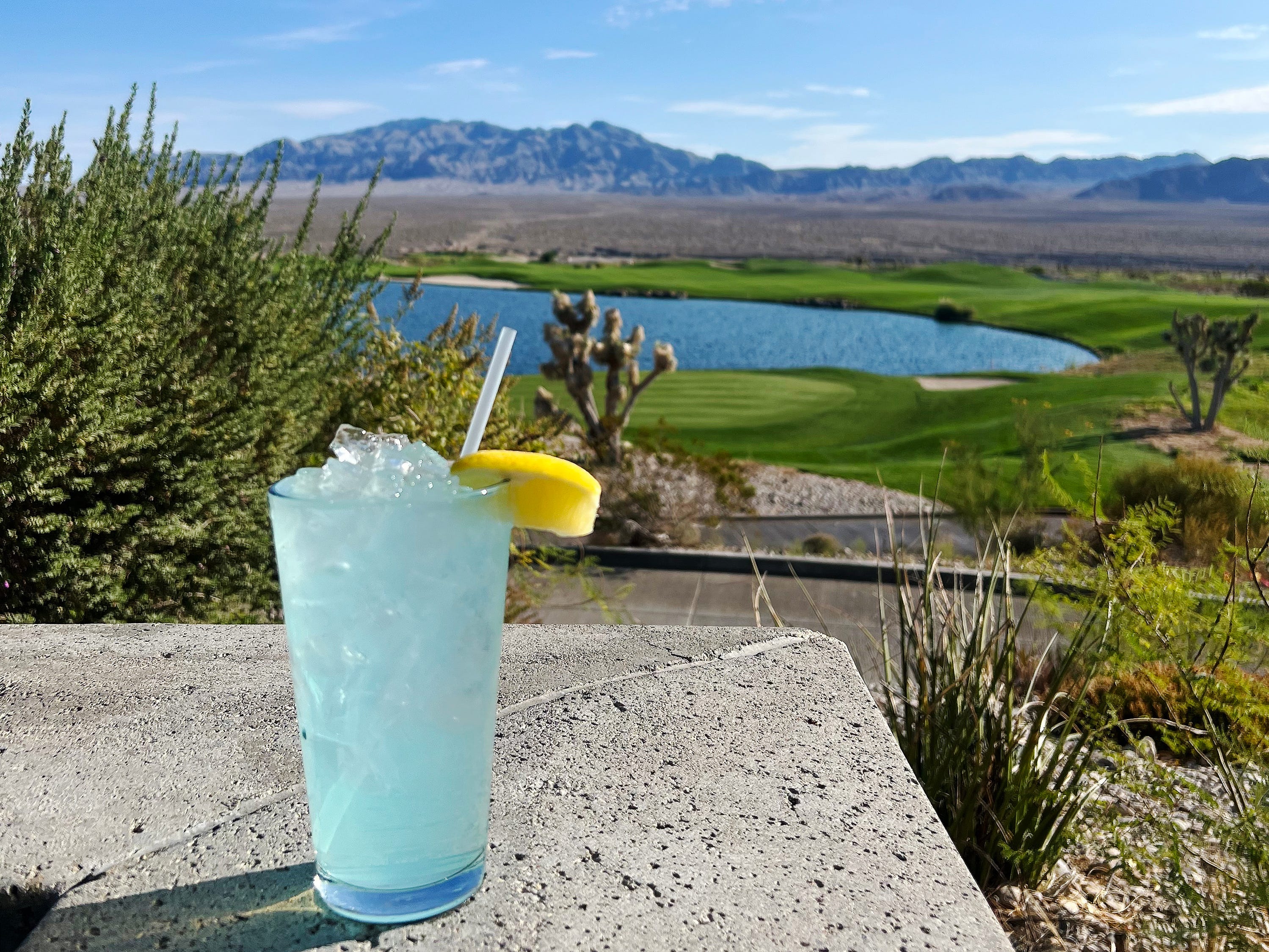 A photo of a blue drink called a Water Hazard on a golf course.