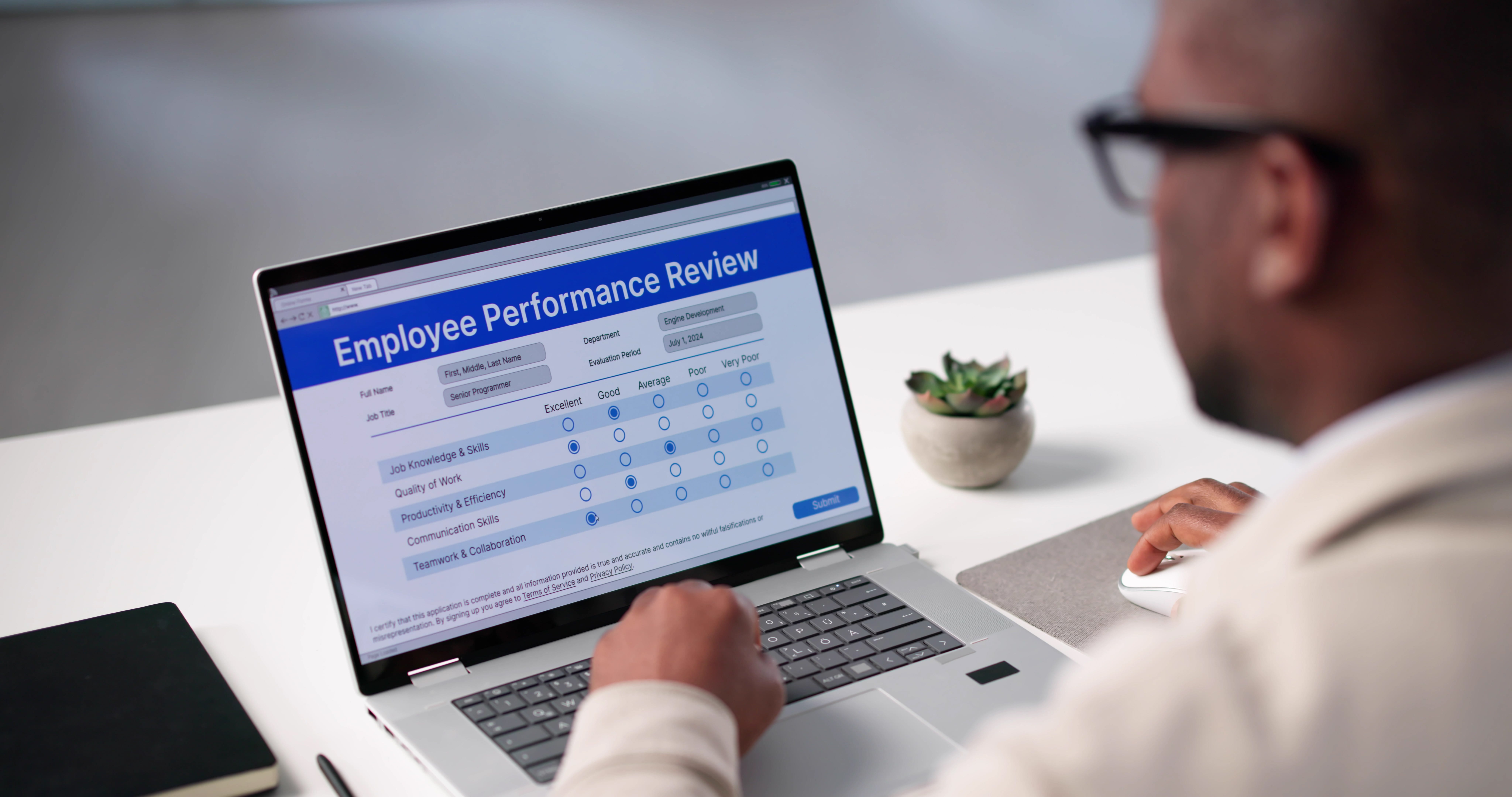 An employee performance review is pictured.