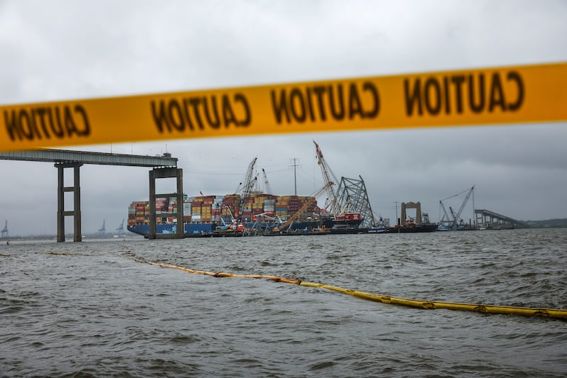 BALTIMORE, MARYLAND - MAY 10: Salvage crew members continue to work to free the cargo ship Dali after if collided with the Francis Scott Key Bridge in the Patapsco River on May 10, 2024 in Baltimore, Maryland. Engineers and other specialists continue to work to free the container ship Dali six weeks after it collided with the bridge, collapsing it and causing the deaths of six construction workers who were repairing potholes in the middle of the night. (Photo by Kevin Dietsch/Getty Images)
