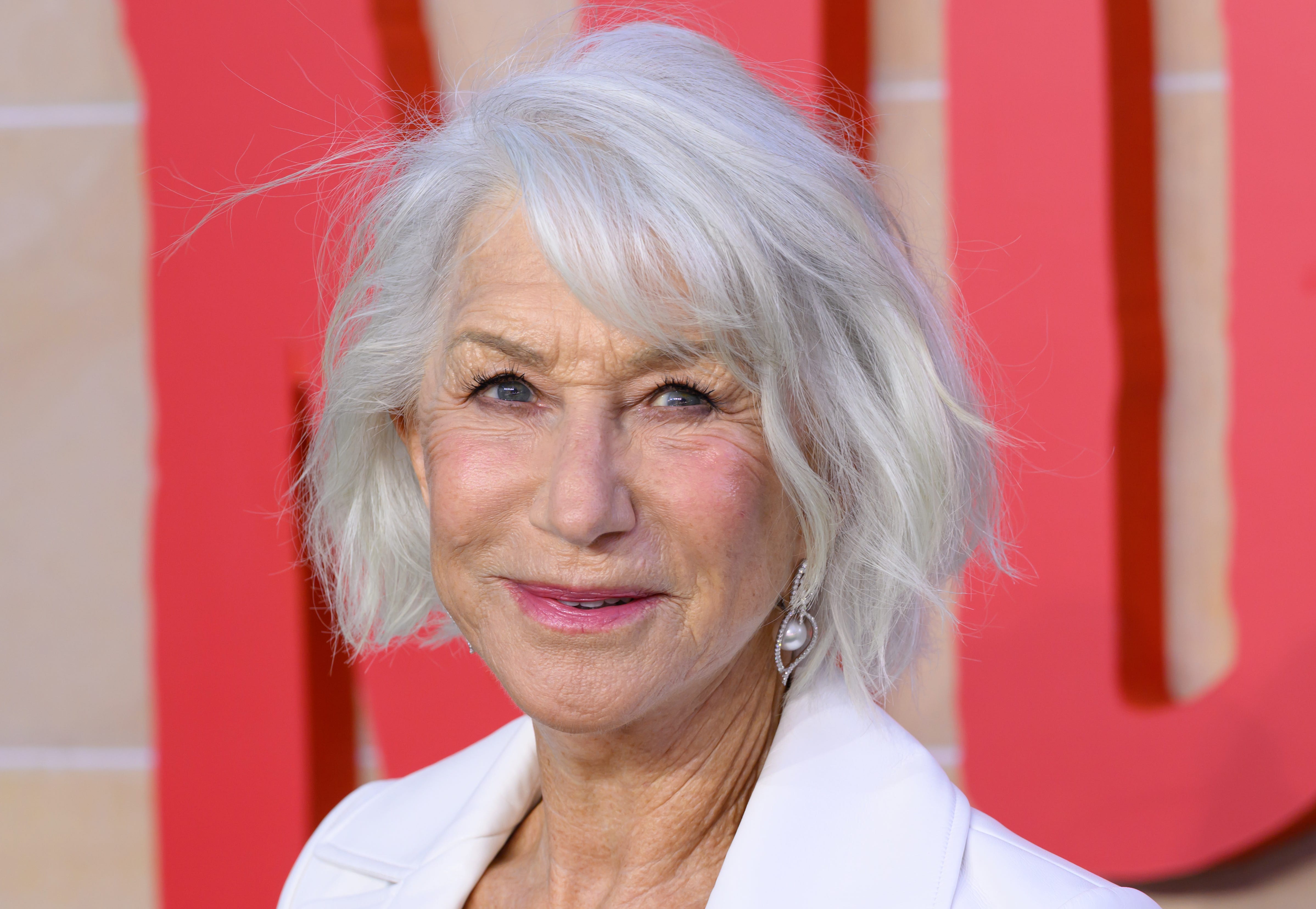 Helen Mirren in a white coat