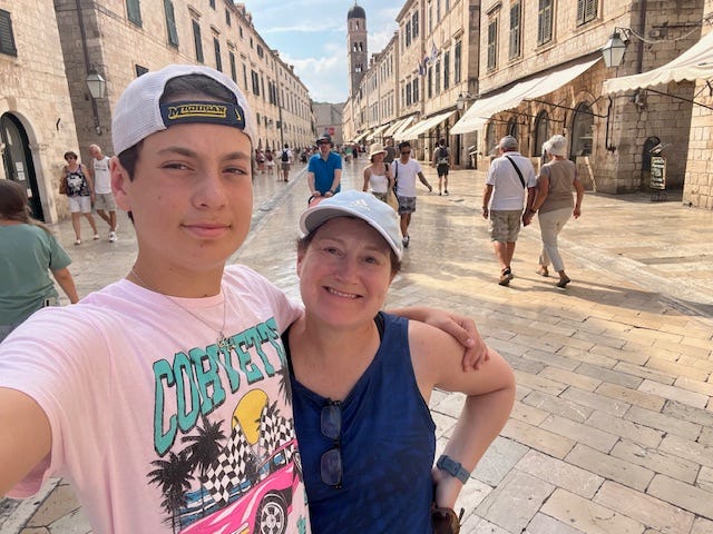 Judy Koutsky with son taking a selfie while traveling in Europe