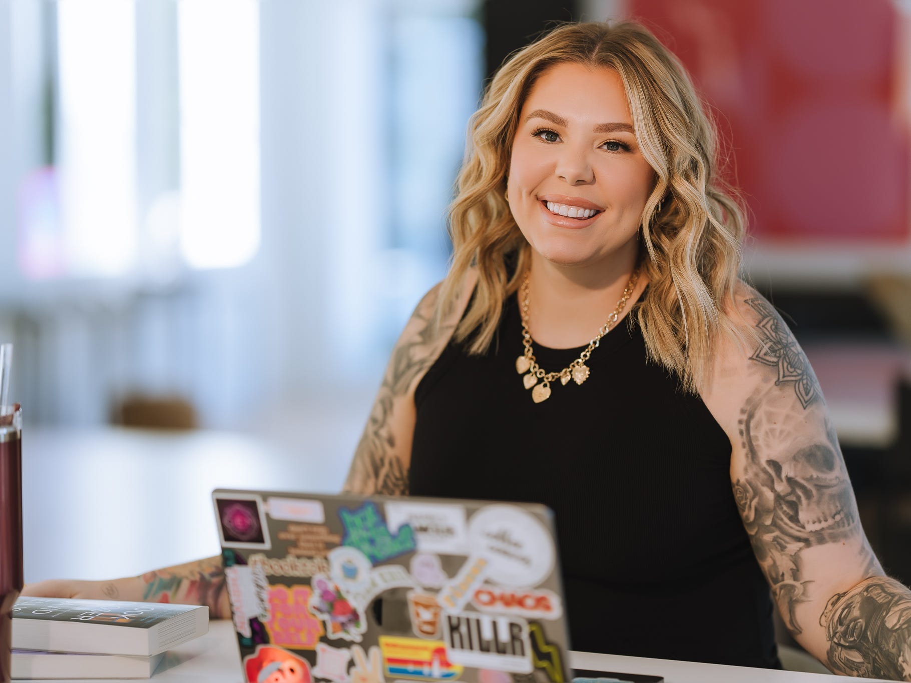 headshot of Kailyn Lowry in front of a computer
