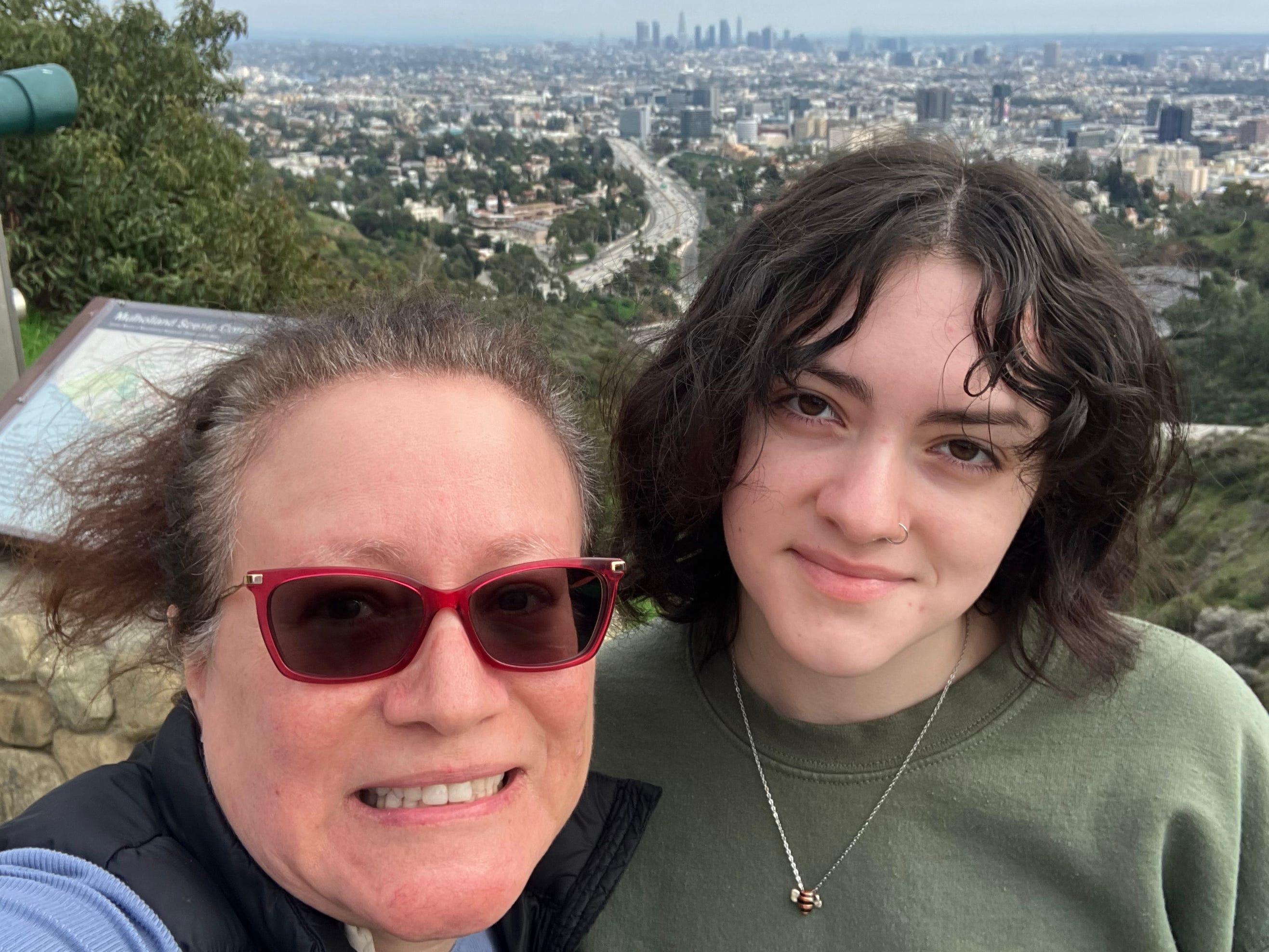 VaNessa Duplessie and her daughter taking a selfie in front of a skyline