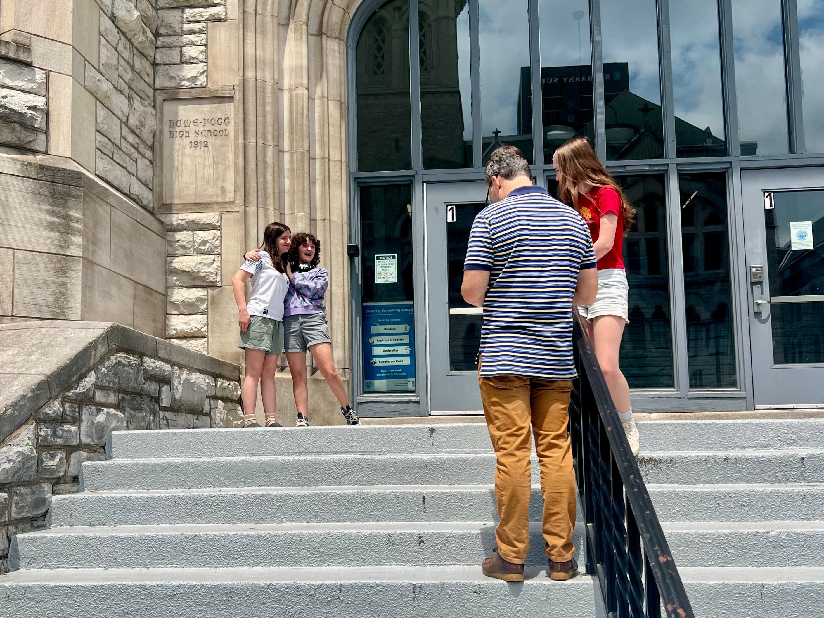 The author's daughters on the steps on the first day of school.