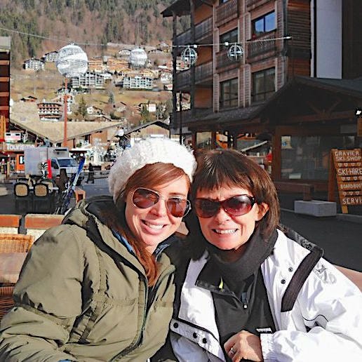 mother and daughter in sunglasses posing for a picture