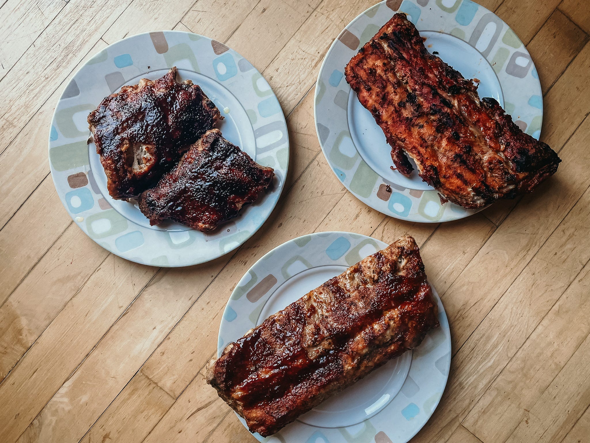 three plates of barbecue ribs