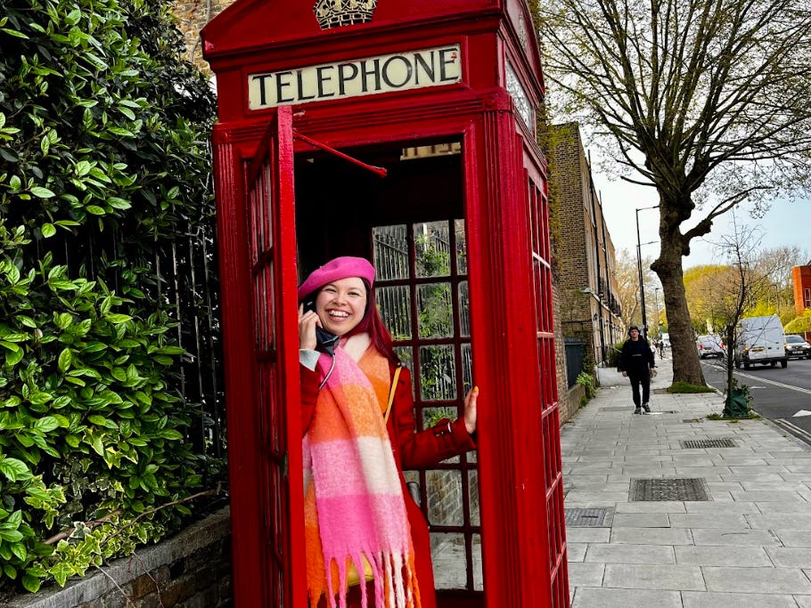 The writer in a phone booth in London.