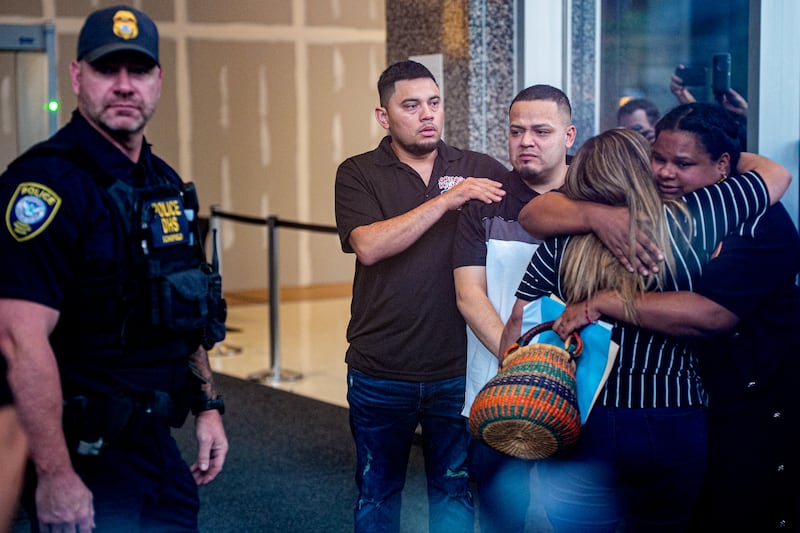 Kilmar Abrego Garcia (3rd-R) accompanied by his wife Jennifer Vasquez Sura (2nd-R) enters a U.S. Immigration and Customs Enforcement (ICE) field office on August 25, 2025 in Baltimore, Maryland.