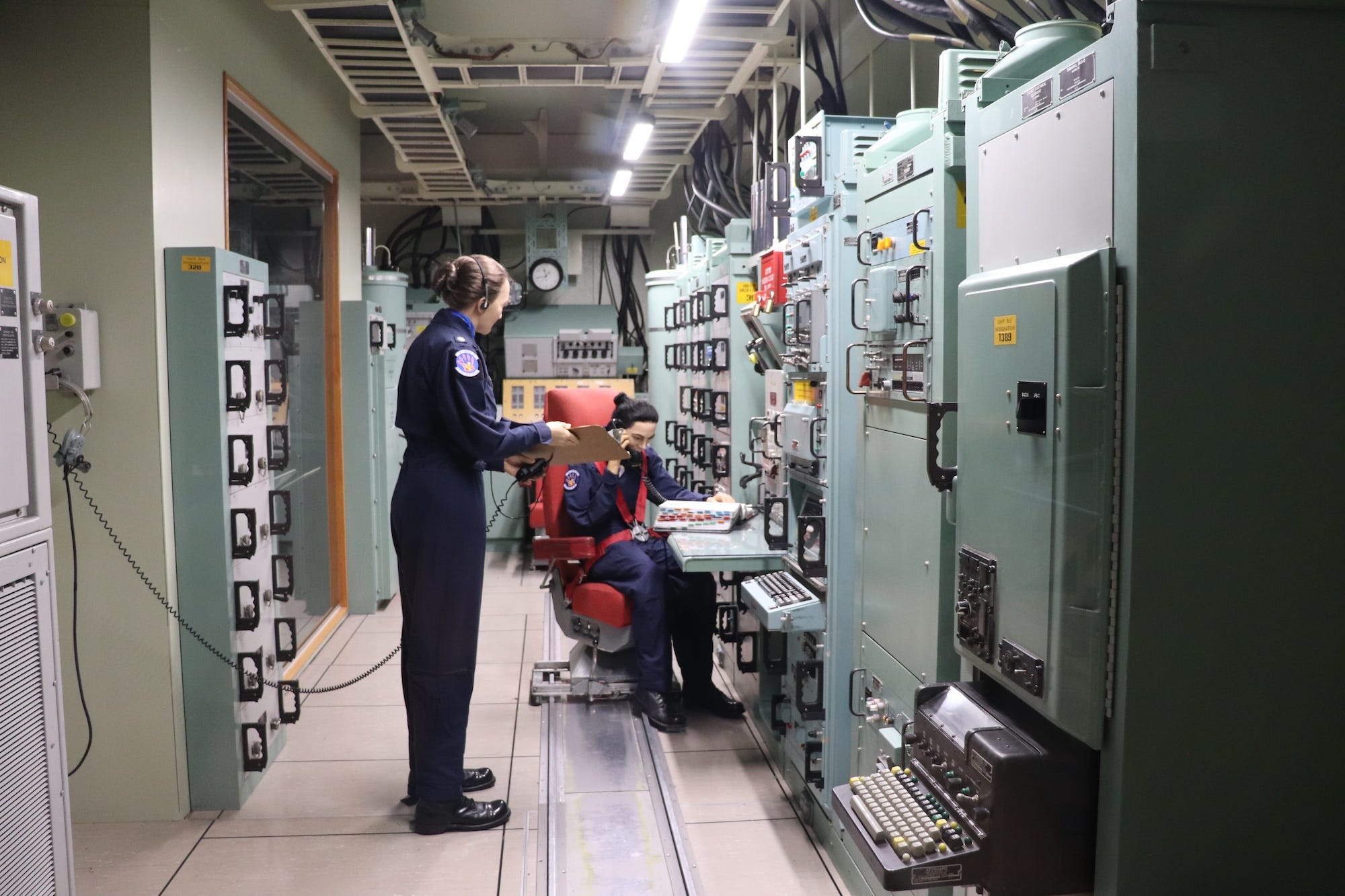 Museum mannequins inside the Minuteman II missile procedures trainer at the National Museum of the US Air Force.