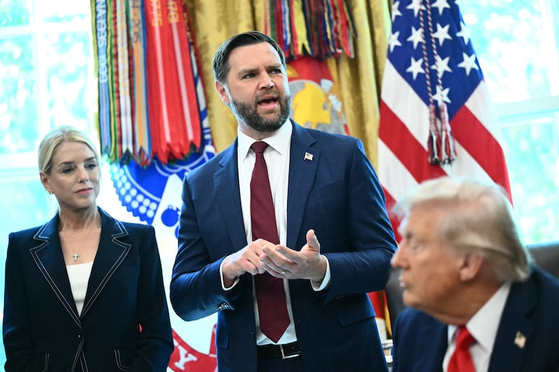 US Vice President JD Vance (C) speaks as US President Donald Trump and US Attorney General Pam Bondi (R) looks on after Trump signed an executive order that to criminalize flag burning.
