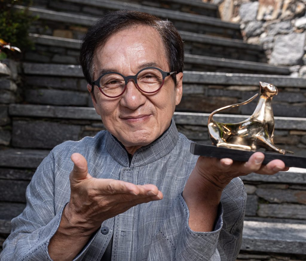 Jackie Chan Fever Hits Locarno As Veteran Actor Accepts Honorary Award & Toasts To The Future: “I Can Still Fight”