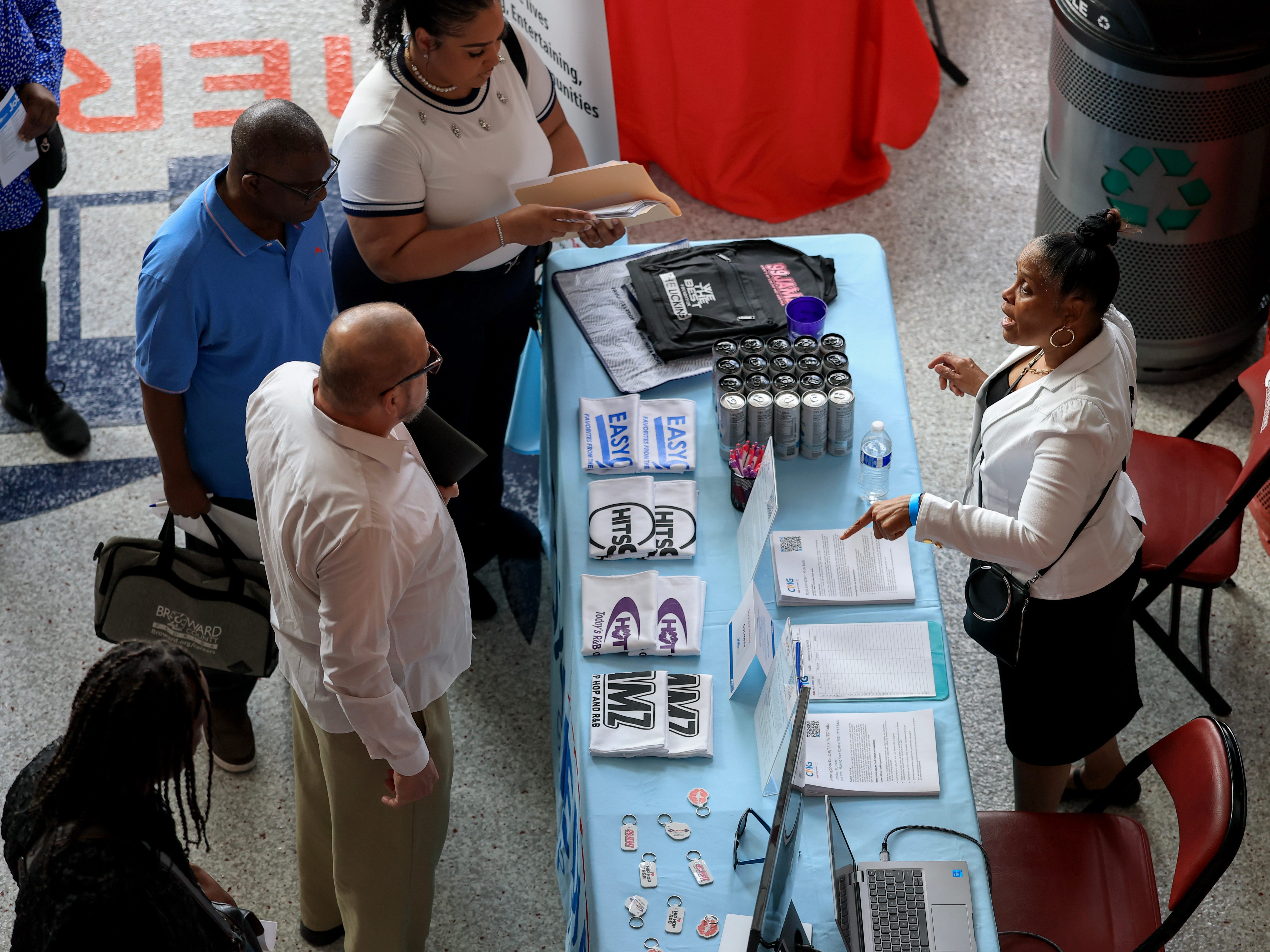 People at a career fair booth