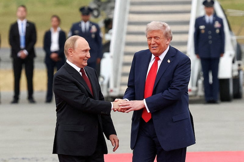 U.S. President Donald Trump shakes hand with Russian President Vladimir Putin
