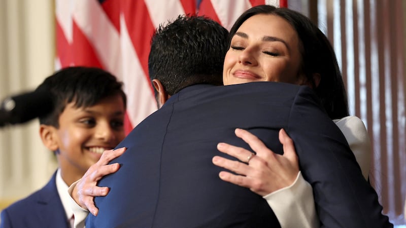 Kash Patel is congratulated by his partner Alekins Wilkins after being sworn in as FBI director by U.S. Attorney General Pam Bondi in the Indian Treaty Room in the Eisenhower Executive Office Building (EEOB) on the White House campus in Washington, D.C., U.S., February 21, 2025. REUTERS/Leah Millis