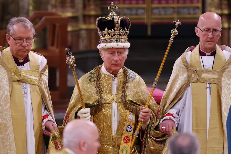 LONDON, ENGLAND - MAY 06: King Charles III stands after being crowned during his coronation ceremony in Westminster Abbey, on May 6, 2023 in London, England. The Coronation of Charles III and his wife, Camilla, as King and Queen of the United Kingdom of Great Britain and Northern Ireland, and the other Commonwealth realms takes place at Westminster Abbey today. Charles acceded to the throne on 8 September 2022, upon the death of his mother, Elizabeth II. (Photo by Richard Pohle - WPA Pool/Getty Images)