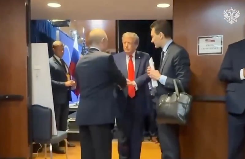 Video from the Kremlin shows Donald Trump shaking hands with Vladimir Putin as his Russian translator looks on behind the scenes at then end of their summit in Anchorage, Alaska.