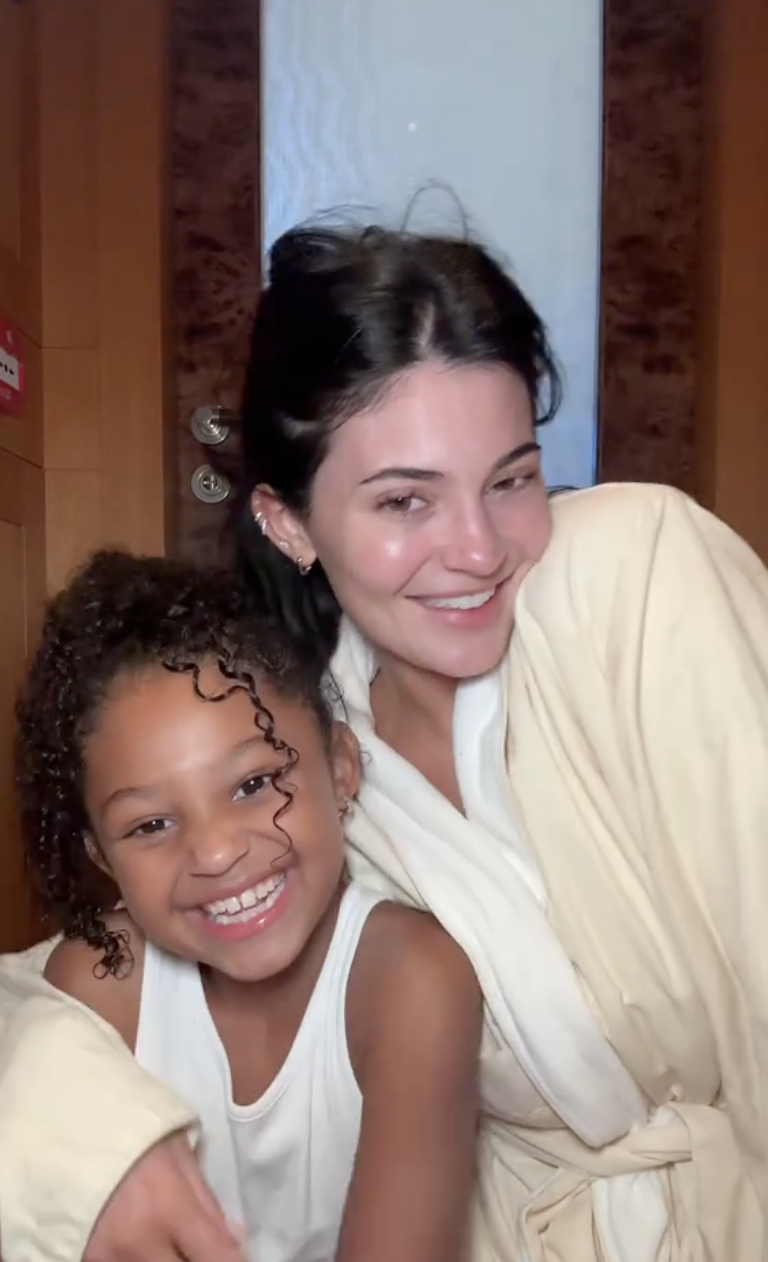 Kylie Jenner and Stormi Webster smiling. 
