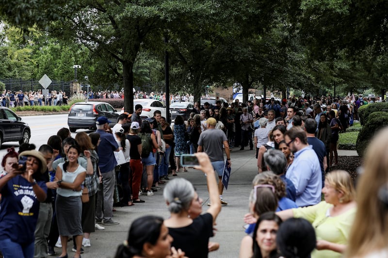 Centers for Disease Control and Prevention (CDC) employees in Atlanta join a clap-out celebration honoring former colleagues who resigned, a day after the White House fired CDC director Susan Monarez and several top officials resigned.