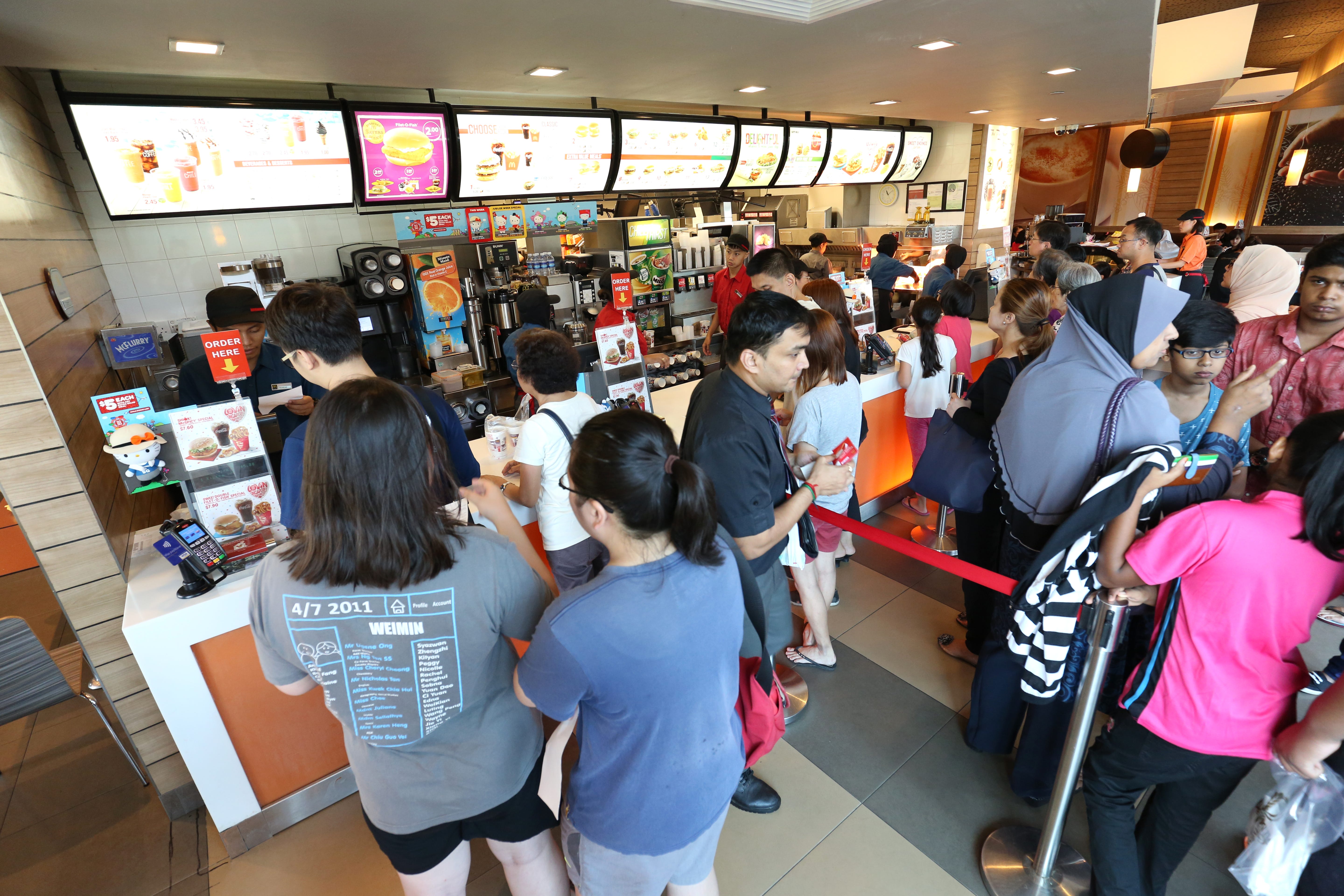 Customers line up to buy the first SG50