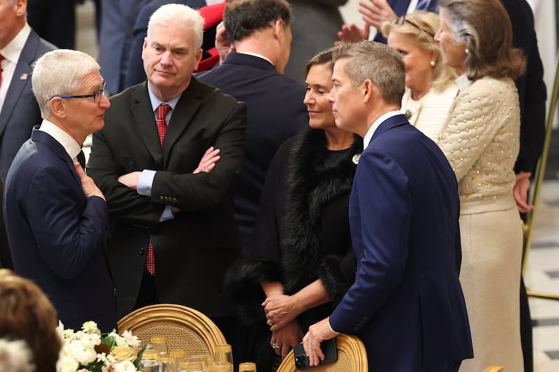 WASHINGTON, DC - JANUARY 20: Rep. Tom Emmer (R-MN) listens as Apple CEO Tim Cook (L) speaks ahead of the inaugural luncheon following inauguration of U.S. President Donald Trump at the U.S. Capitol on January 20, 2025 in Washington, DC. Donald Trump takes office for his second term as the 47th president of the United States. (Photo by Kevin Dietsch/Getty Images)