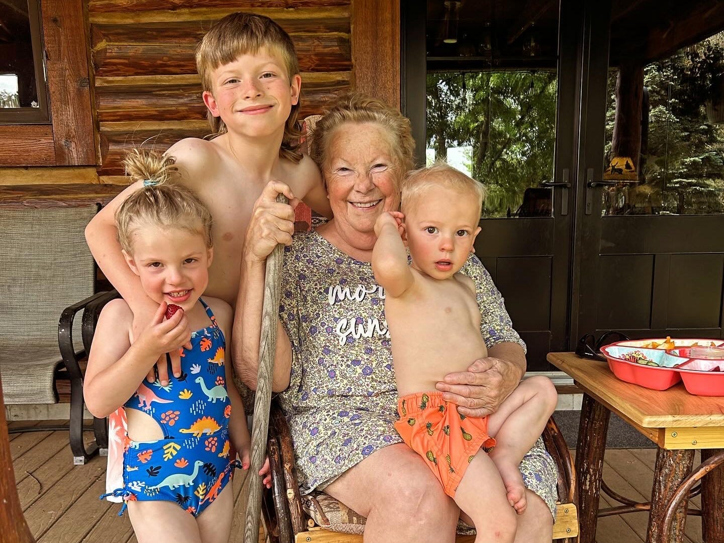 The author's three kids pose with their neighbor.