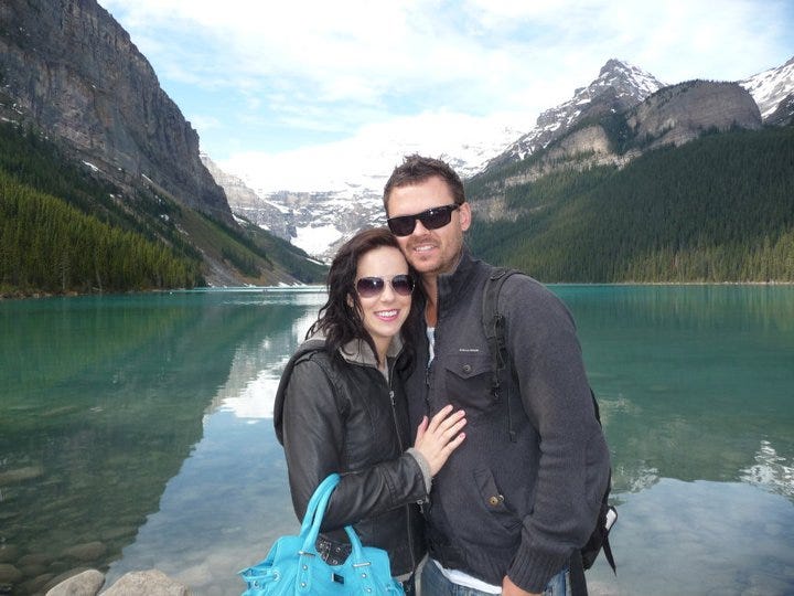 The author and her husband in front of a lake in Canada.
