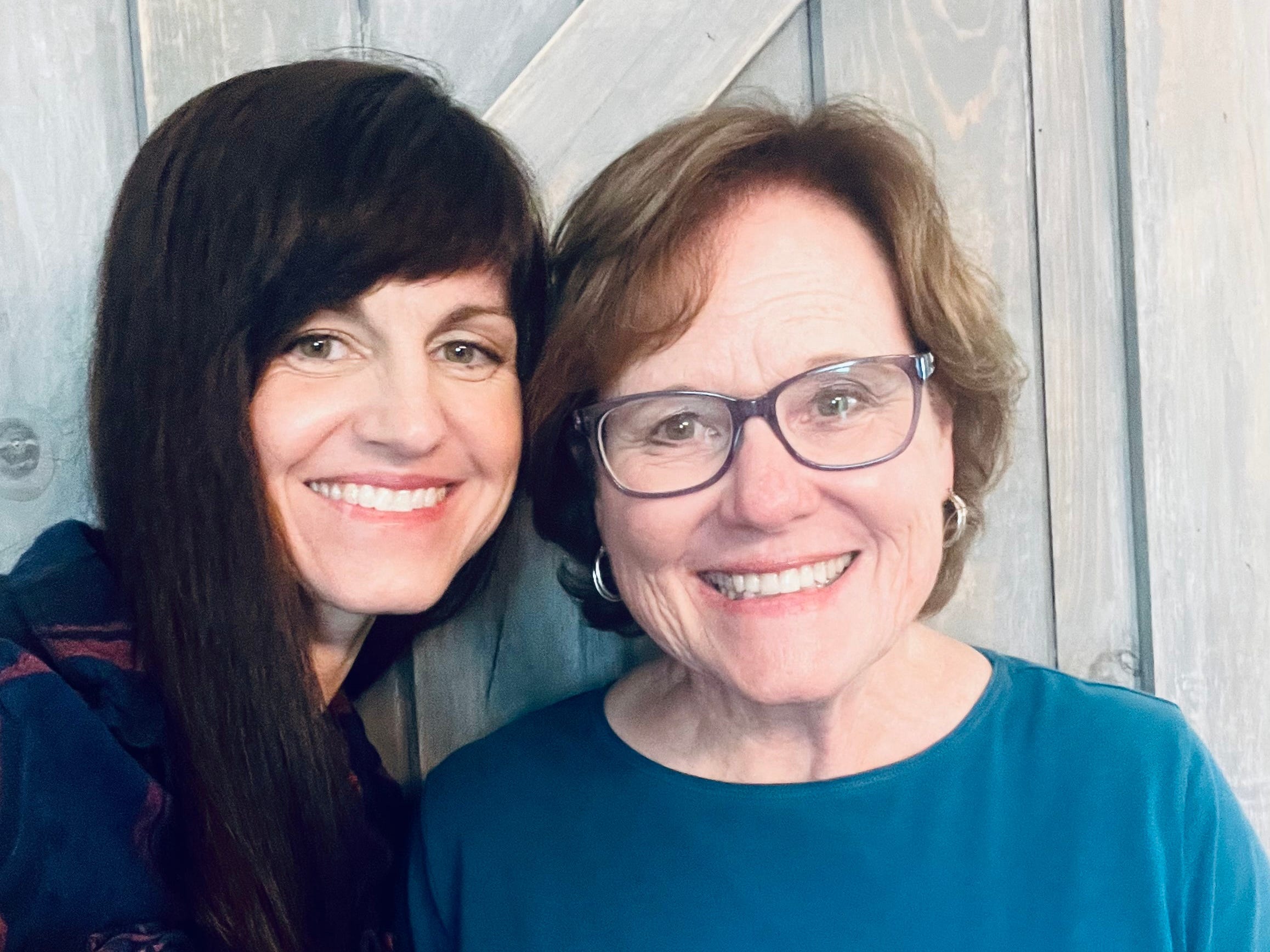 The author with her mother, smiling at the camera.