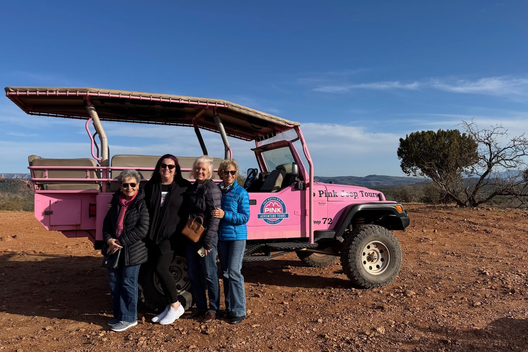 The writer, her mom, and her sisters on a Pink Jeep tour in Sedona.